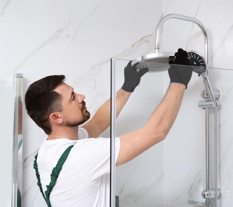 Guardian Building Products Values Image - Plumber installing a shower
