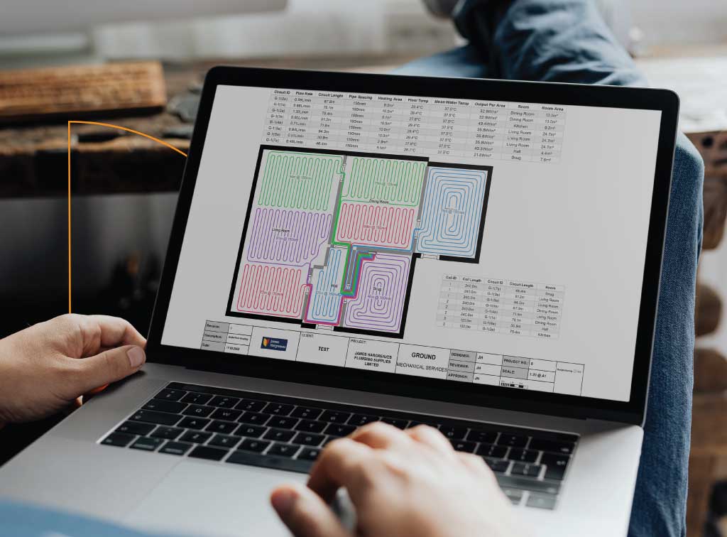 Trade professional holding laptop on lap, screen features underfloor heating plan
